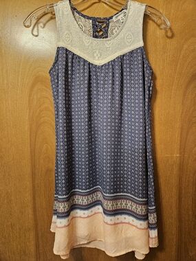 Eyeshadow Navy Blue Printed Sleeveless Dress with Cream Lace Yoke and Peach Hem